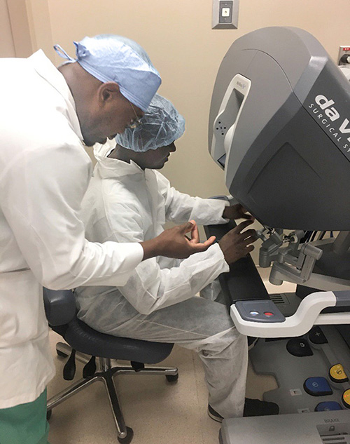 Tarik Simpson learns how to use a scientific instrument while doing a research project at his home institution. (Image courtesy of Tarik Simpson.)